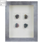 Silver-framed stone wall art with four colorful textured mineral specimens in a grid for unique wall decor
