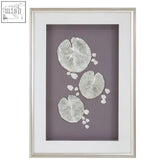Silver framed nason silver leaf design wall art with embossed white lily pads and wooden frame on lavender background