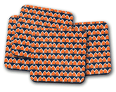 Set of four square coasters with bold orange retro geometric fan pattern and navy blue accents for table decor