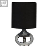 Shiny chrome globe-shaped niko table lamp with black fabric shade and modern design for stylish lighting
