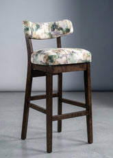 Dark wood ninna tall stool with curved back and floral upholstered seat in green beige and purple tones