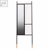 Nirav black floor mirror with coat rack features black frame, geometric design, one reflective panel, and gold feet