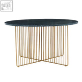 Modern oval coffee table with sleek black marble top and gold frame coffee legs in an elegant intersecting wire design