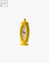 Bright yellow oval table clock with white face and black numbers for lounge room by nivedita clocks offer financing