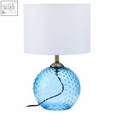 Noa blue glass table lamp with textured bubble-like glass base and white cylindrical shade perfect for cozy lighting