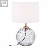 Noa grey glass table lamp with textured spherical grey glass base and white cylindrical shade for ambient lighting