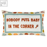 A rectangular needlepoint cushion with puts baby dirty dancing quote in orange thread on white center and colorful border