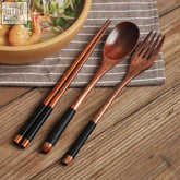 Noni 3 piece cutlery set with wooden chopsticks spoon and fork featuring black textured grips