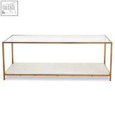 Gold frame coffee table with clear glass top and white terrazzo textured lower shelf for stylish living rooms