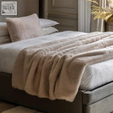 Beige oatmeal faux fur throw blanket with plush soft texture and gentle waves of pile perfect for cozying up