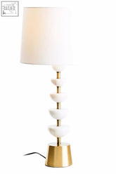 Ocala white table lamp with a white drum shade, polished white marble discs, gold rings, and solid brass base