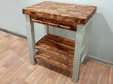 Rustic olive wood butcher block kitchen cart with light gray painted legs and shelves for food prep and storage