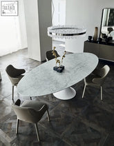 Elegant omer oval dining table with white marble top and minimalist pedestal base perfect for any dining room