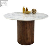Round marble-top mango wood dining table with dark wood vertically ribbed pedestal base perfect for wood dining rooms