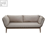 Beige cushioned opus three seat sofa with woven dark brown frame and tapered legs perfect for outdoor use