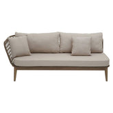 Beige cushioned rope chaise longue with woven wicker frame and wooden legs perfect for relaxing outdoors