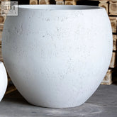 A large round white mist orbello 110cm planter with textured concrete finish perfect for outdoor plants