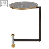 Oria black side table features a sleek black glass metal frame with gold accents and a dark gray marble top