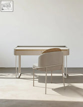 Minimalist otto office desk with white sintered stone top, sleek metallic frame, light wood accents, and matching chair