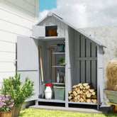 Gray wooden outsunny garden shed with asphalt felt tilt roof open doors show shelves and stacked firewood storage