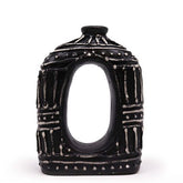 Black ceramic oval donut shaped vase with white geometric patterns and a central oval opening for dry flowers