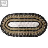 Oval woven seagrass rug with black white and tan concentric stripes perfect for classic home decor 60x120cm