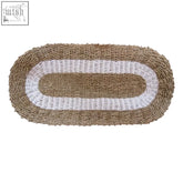Beige and white woven oval seagrass rug with textured braided design in 60x120cm size