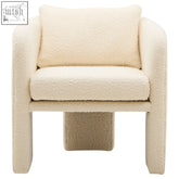 Cream-colored ivory boucle curved armchair with plush textured fabric cushion and distinctive blocky legs