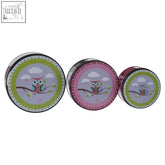 Set of three happy owls metal storage tins with colorful cartoon owl designs and pastel pink green lids