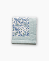 Folded square cotton handkerchief with delicate blue and green floral print and mint stripe border handmade item hand blocked