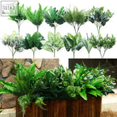 A collection of party joy 14 pcs artificial plants outdoor with green leaves in various shapes in a wooden planter