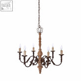 Paulette 6 arm chandelier with a wooden body, black tones, and nine candle-style bulbs for rustic charm