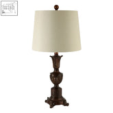 Bronze-finished pembroke table lamp with ornate fluted base and cream linen shade for stylish lighting