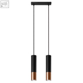 Black cylindrical steel pendant lamp loopez with copper accents hanging from black ceiling mount with gu10 light bulb