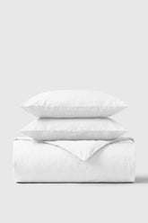 White cotton percale duvet cover set with two matching pillows perfect for a cozy bedroom look