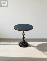 Black percival small round side table with polished wooden top and ornate turned pedestal base for dining table use