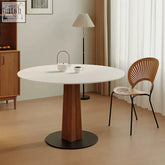 Percival white round dining table with wooden pedestal base and black circular foot perfect for white round dining rooms