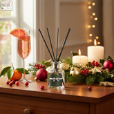 Clear glass reed diffuser with black reeds and dark green sparkling cranberries label perfect presents 100ml bottle
