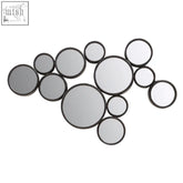 A persephone black multi wall mirror set with scattered circular black framed mirrors in an asymmetrical pattern