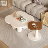 White cloud-shaped persis coffee table set with rounded padded legs and smooth cream tan surface perfect for living rooms