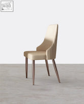 Beige upholstered peru dining chair with cream fabric and sleek tapered metal legs for stylish dining seating