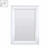 Petillo thick silver frame rectangular wall mirror with a sleek white glossy frame and beveled edges