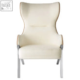 Cream-colored piermount ivory wingback chair with high back and sleek metallic legs for stylish seating