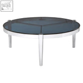 Piermount round coffee table with a dark gray glass top and sleek chrome legs perfect as a round coffee table
