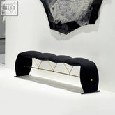 Black upholstered pineda bench with sleek gold metal supports high density sponge curved seat panels