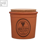 Porto biscuit canister terracotta biscuit canister with cork lid and oval label saying biscuits in bold black lettering