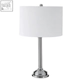Silver-finished portobello table lamp with sleek cylindrical base and cream drum shade for modern lighting