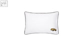 White standard pillow case with black cord piping and small gold car embroidery on the lower right corner