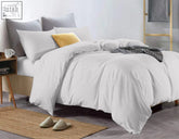 White cotton duvet cover with soft wrinkles and subtle sheen in light grey from pure egyptian cotton bed set