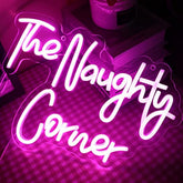 A glowing pink neon sign shaped like a cloud with white cursive words the naughty corner qiaofei led neon sign